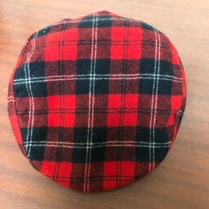 Man’s red plaid hat